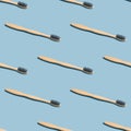 Zero waste, sustainable bathroom and lifestyle concept. Seamless pattern made of bamboo toothbrush, blue background Royalty Free Stock Photo