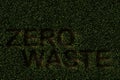 Zero waste text cut out from grass background, reducing waste or garbage or recycling concept on brown soil background Royalty Free Stock Photo