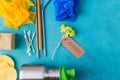 Zero Waste Things.Reusable things for eco life: bottle, bamboo straw and ear stick, shoe covers Royalty Free Stock Photo