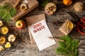 Zero west and eco friendly christmas concept flat lay with gift, branches and candle on rustic wooden background. making