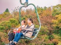 Motion Blur of Unacquainted tourist sitting on Chairlift Ropeway Crossing the mountain on Tianmen mountain