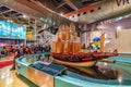 Zheng He`s Treasure Ship model in Hong Kong Science Museum. Interior view. People watch attractions demonstrating various physica Royalty Free Stock Photo