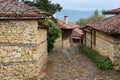 Cobbled road and old traditional houses in Zheravna, Bulgaria Royalty Free Stock Photo