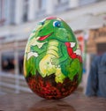 Zhitomir, Ukraine - April 10, 2018: Easter eggs with a painted dragon on a background of the city