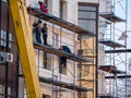 ZHITOMIR, UKRAINE - December 1, 2019: Workers at builing construction area