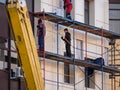 ZHITOMIR, UKRAINE - December 1, 2019: Workers at builing construction area