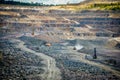 Zhodzina, Belarus - August 16, 2013: Granite mining in Quarry Trucks quarry of BelAZ producer