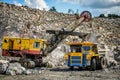 Zhodzina, Belarus - August 16, 2013: Granite mining in Quarry Trucks quarry of BelAZ producer