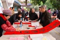 People writing Chinese new year scrolls