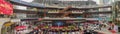 People writing Chinese new year scrolls and looking live show in a shopping mall