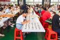 students in calligraphy competition using Chinese brushes at horizontal composition