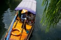 ZHOUZHUANG, CHINA: Helmsman driving the boat passing through canals