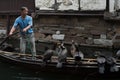 ZHOUZHUANG, CHINA: Helmsman driving the boat passing through canals
