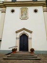 door with beautiful portal to the temple with two flower pots Royalty Free Stock Photo