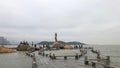 Zhuhai, China - May 2019: Tourists visiting the famous fisher girl in Zhuhai, China