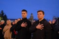 Zhytomyr, Ukraine - February 20, 2022: two young men put hands on their hearts.