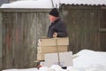 Zhytomyr, Ukraine - January 8, 2018: Adult homeless man with cardboard in cold winter