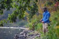 25.09.2016 Zhytomyr, Ukraine, a man with a fishing rod in his hands catches fish on the river`s coast