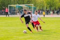 Zhytomyr, UKRAINE - May 21, 2017: Football players are playing football soccer game in an open field Royalty Free Stock Photo