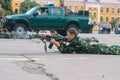 Zhytomyr, Ukraine - May 03, 2015: happy teen boy shooting on a stump at competition