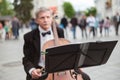 Zhytomyr, Ukraine - May 15, 2021: man street musician playing cello classical music