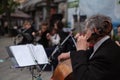 Zhytomyr, Ukraine - May 15, 2021: man street musician playing cello classical music Royalty Free Stock Photo