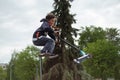 Zhytomyr, Ukraine - May 15, 2021: Teenager did unsuccessful trick on sportive push scooter on a city sports ground