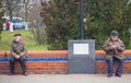 Zhytomyr, Ukraine - October 19, 2015: Two senior gentlemen sitting and relaxing on a wooden bench in a park Royalty Free Stock Photo