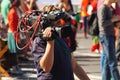 Cameraman while working outdoors - reportage for television