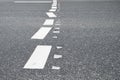 Deranged road markings on asphalt Royalty Free Stock Photo