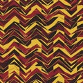 Zigzag pattern in red, yellow, and black with overlapping angular shapes. The design Royalty Free Stock Photo