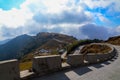 A zigzag road below the blue white cloud is beautifully arranged everything in a zigzag road Royalty Free Stock Photo