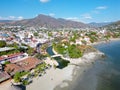 Zihuatanejo Beach with River Mouth - Image: Serene Confluence of River and Ocean Royalty Free Stock Photo