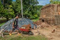 Worker and wheelbarrow, Terracotta kiln, Colonia Aeropuorto, Zihuatanejo, Mexico