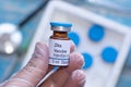 Zika virus vaccine vial in doctors hand