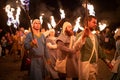 Zilina, Slovak RepubliÃÂ, Slovakia - July 28, 2023: People dressed in medieval dresses with a flaming torches