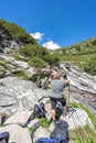 Zillertal, Austria - Aug 7, 2020: Hikers take a rest on trekking way to Olpererhutte