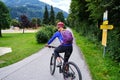 Woman on a bike route in Zillertal valley, Austria