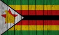 Zimbabwe Flag Over Wood Planks