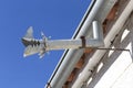 Zinc gutter drainage system dragon-shaped over blue sky