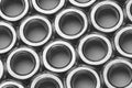 Zinc plated hexagonal nuts arranged in rows. Full frame patterned background