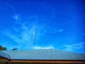 The zinc tile roof of the office is blue with a clear sky as a background Royalty Free Stock Photo