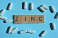 Zinc, word and white capsules