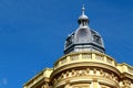 Zink dome with colorful natural slate tile roof and rich, ornate stucco exterior