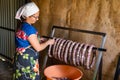 Zinkov. Ukraine. June 17, 2020. A woman makes a traditional homemade sausage