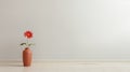 Minimalist Imagery: A Clean And Streamlined Room With A Red Vase