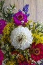 Zinnia flowers and other flowers in a beautiful bouquet on old grunge wooden background ErÃÂ­geron Royalty Free Stock Photo