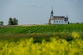 Zion Lutheran Church and graveyard near Kyle, Saskatchewan with a canola and lentil field Royalty Free Stock Photo