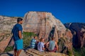 ZION, UTAH, USA - JUNE 14, 2018: Outdoor beautiful view of young hikers looking at view in Zion National park. People