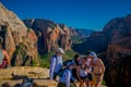 ZION, UTAH, USA - JUNE 14, 2018: Outdoor beautiful view of young hikers looking at view in Zion National park. People